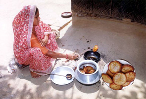 চিত্র:PithaMaking.jpg
